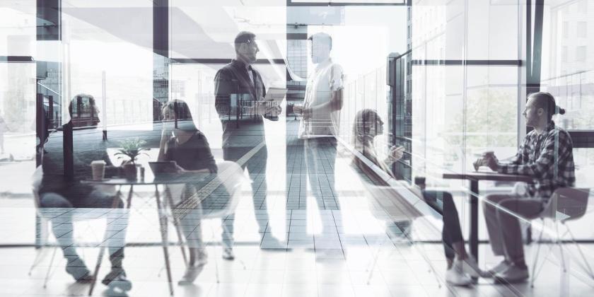 Concept background with business people silhouette working in a modern office